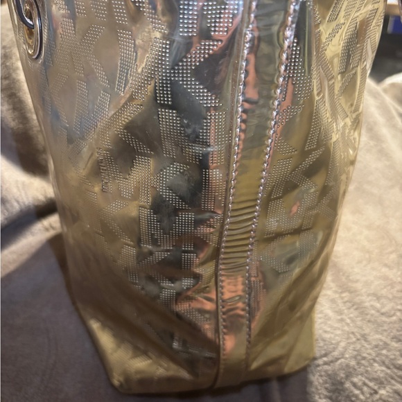 Michael Kors Women's Gold Metallic XL Tote Bag .
16” W x 11” T x 6.5” D - Picture 9 of 16